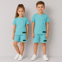 Ідеальний базовий костюмчик на літо з нашивкою "Designed wear"  бірюза